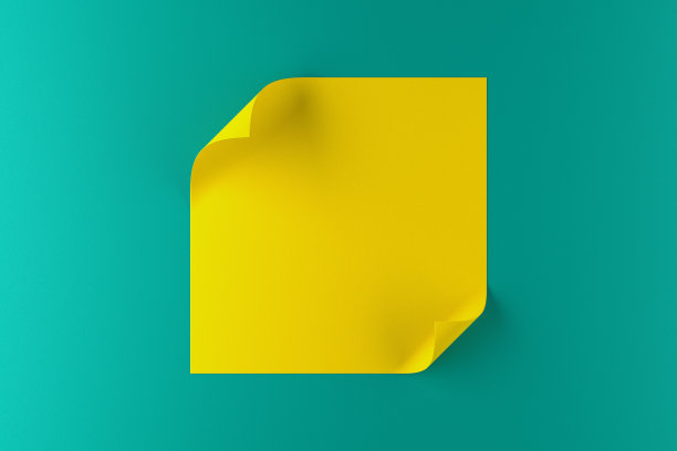 在绿松石色背景上有弯曲边缘的一张黄色纸图片下载