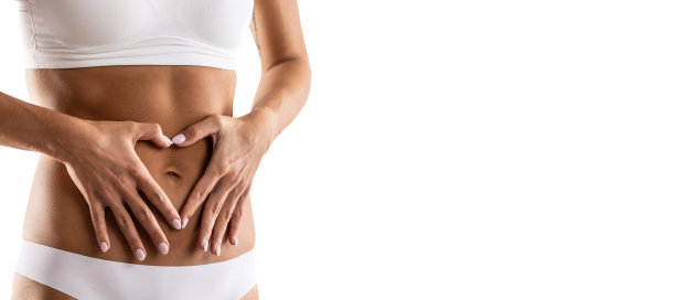 女性身体中部，手部呈心形。穿内衣的女人象征着健康的生活方式、健康的胃、月经或怀孕。图片下载