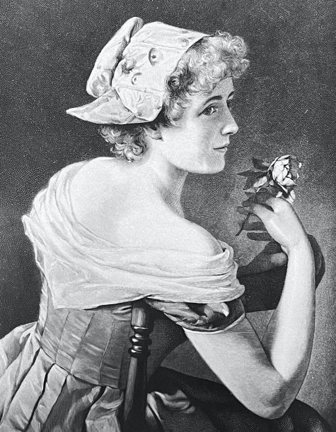 年轻漂亮的女人，坐在椅子上，侧视，手里拿着一朵花图片下载