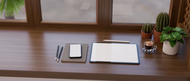 工作区有平板电脑模型，智能手机和现代经典的木制桌面装饰植物图片下载
