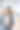 微笑的年轻亚洲女商人站在办公室里。垂直的肖像图片下载