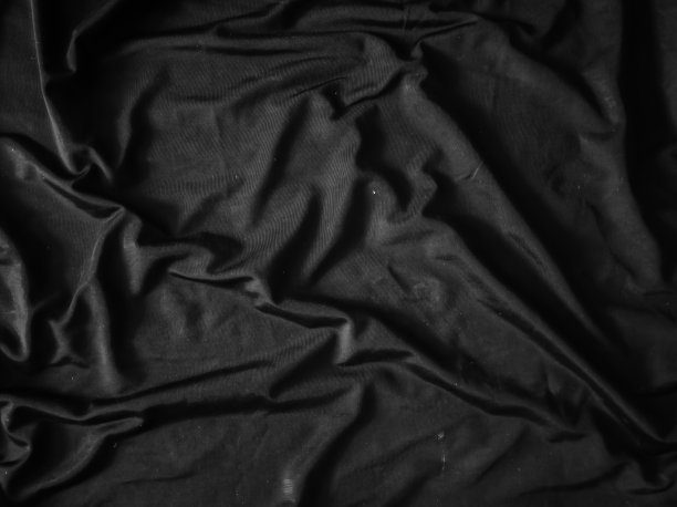 柔软的黑布背景，丝绸，优雅，单色，优雅的黑布背景。很模糊。缎图片下载