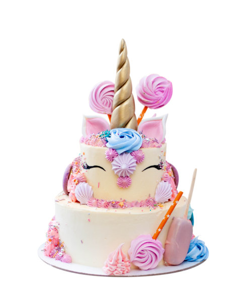 华丽的独角兽蛋糕，金色的华夫饼角，睫毛和奶油奶酪糖霜孤立在白色的背景图片下载