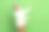 照片的养老金领取者有趣的女人穿白色的背景，灰色的头发测量手拿产品对象孤立的绿色背景图片下载