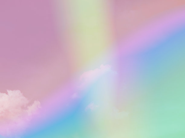 美丽甜美柔和的绿色，粉红色的彩色与天空中蓬松的云。多色彩虹图像。抽象幻想生长之光图片下载