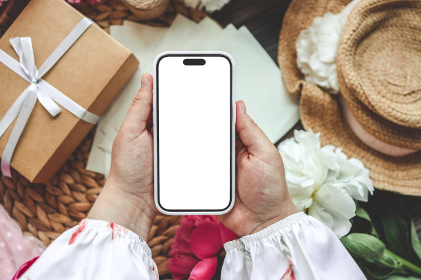 手机和春花牡丹以喜庆为背景。主题是爱，母亲节，妇女节平平安安图片下载