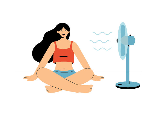 女孩享受着风扇吹来的凉风图片下载