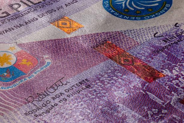 100比索纸币的极端微距摄影。一张100菲律宾比索的超近距离照片。菲律宾岛国的私人和公共法定货币。微观捕捉图片下载