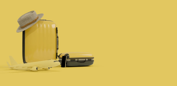 黄色旅行袋与飞机模型在黄色的主题图片下载
