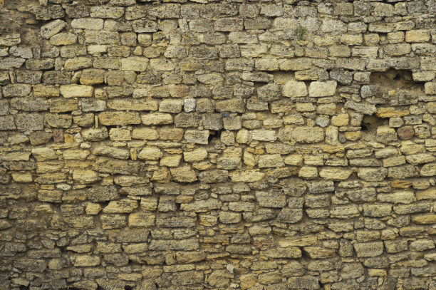 古老堡垒城墙上的古老石雕图片下载