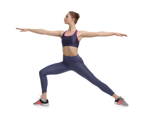 年轻女子在白色背景上练习瑜伽图片下载