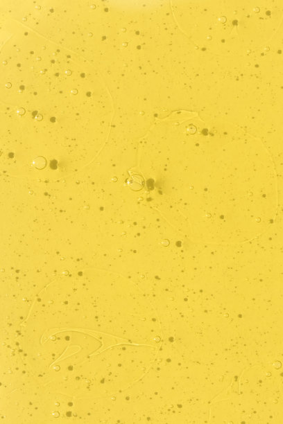 透明化妆品凝胶或黄色血清。带有气泡的化妆品纹理。防止病毒或化妆品的概念。前视图。图片下载