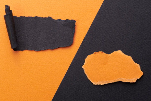 边缘被撕破的纸片的艺术拼贴。便利贴收集橙色黑色的颜色，笔记本页的碎片。抽象的背景图片下载