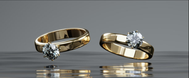 两枚金钻戒漂浮在水面上的景象。从设计到3D渲染。图片下载