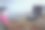 一个男孩正在用鼠标和键盘操作电脑，他正看着电脑系统里的图片。图片下载