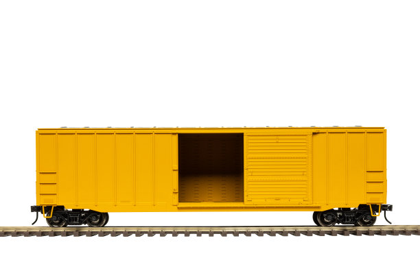 黄色铁路车厢在轨道上图片下载
