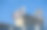 奈莱克斯时钟在一系列旧混凝土筒仓上方图片下载