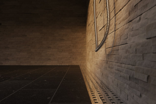 在傍晚的阳光下，淋浴盘上的黑色石瓦金属水槽的3D渲染图图片下载