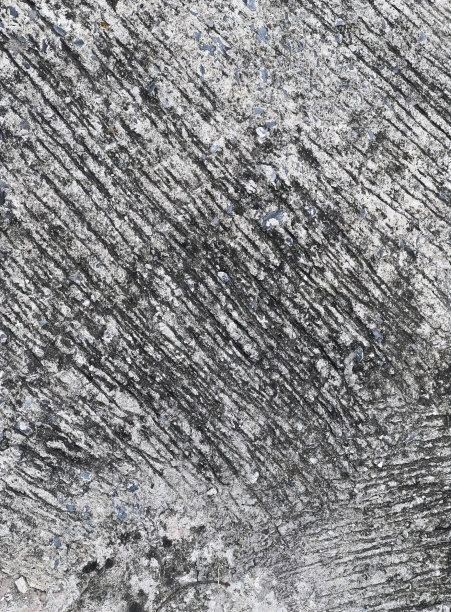 一张黑白照片的摄影，一个积雪覆盖的地面，拱顶的混凝土表面粗糙，凹凸不平的表面。图片下载