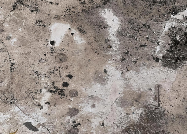 一张肮脏地板的照片，中间有一个黄色的物体。图片下载