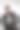 商人穿着黑白相间的孤立肖像，20多岁的成功男子手放在大腿上图片下载