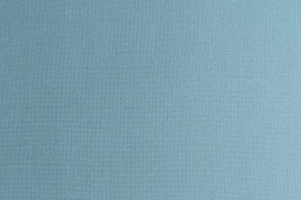 真丝原汁原味的天然织物壁纸纹理背景在暗闪亮的蓝色牛仔灰色色调图片下载
