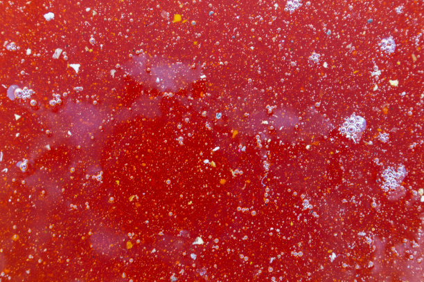 深红色新鲜蜂蜜的口感。新鲜荞麦蜂蜜。俯视图背景照片。图片下载