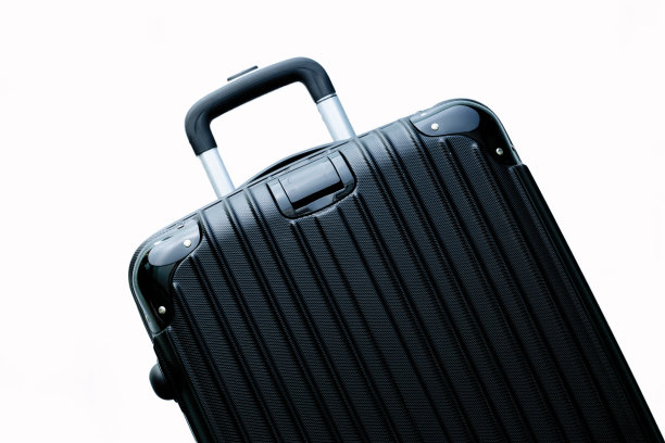 黑色行李箱隔离在白色背景，黑色手推车袋隔离在白色背景。无拉链手提行李袋。Vip手推车袋。手推车旅行袋。微调控制项的树干。推着行李。侧视图现代行李箱图片下载