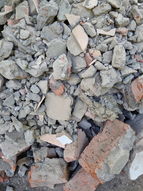 修复。建筑垃圾。一堆碎砖、混凝土和瓷砖。表现主义。背景图片。图片下载