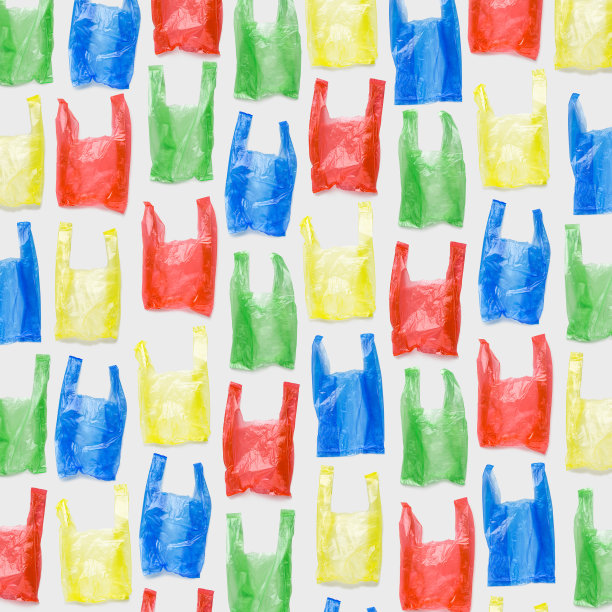 俯视图图案从彩色塑料袋。一次性聚乙烯包装，减少一次性塑料的环保趋势，可生物降解的包装废弃物，创意照片图案为设计背景图片下载