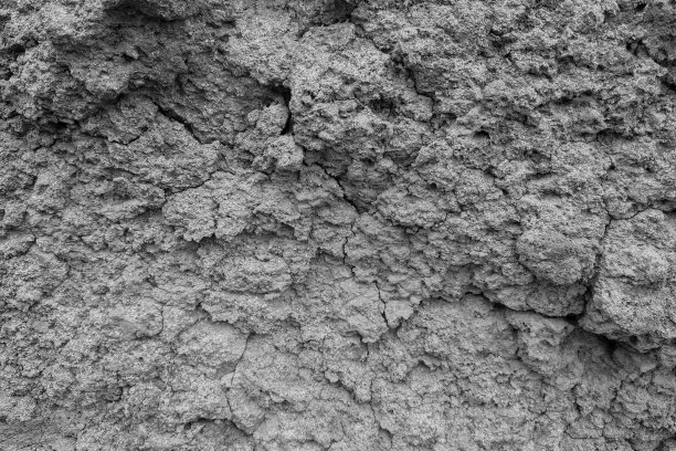 黑白照片。裂开的泥土的纹理。石头的背景。图片下载