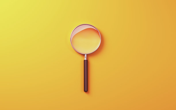 软橙色背景金属放大镜图片下载
