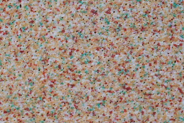 塑料玩具表面多色斑点和小气泡的微距照片。图片下载