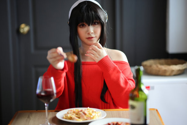 一个漂亮的年轻女人的肖像，穿着红色的毛衣图片下载