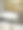 特写照片:折叠的白色毛巾挂在盥洗台的毛巾架上，大理石托盘上有倒扣的水杯，大理石浴室柜台上有单色之字形图案的墙砖，墙上装着镜子图片下载