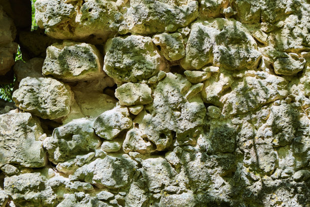 石墙照片的背景纹理。天然石材墙面纹理为背景。旧砖纹理图片下载