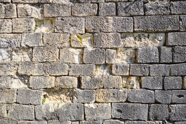 石墙照片的背景纹理。天然石材墙面纹理为背景。旧砖纹理，grunge背景图片下载