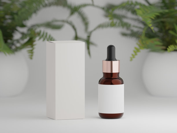 琥珀滴管瓶与包装盒上的白色背景与室内植物图片下载