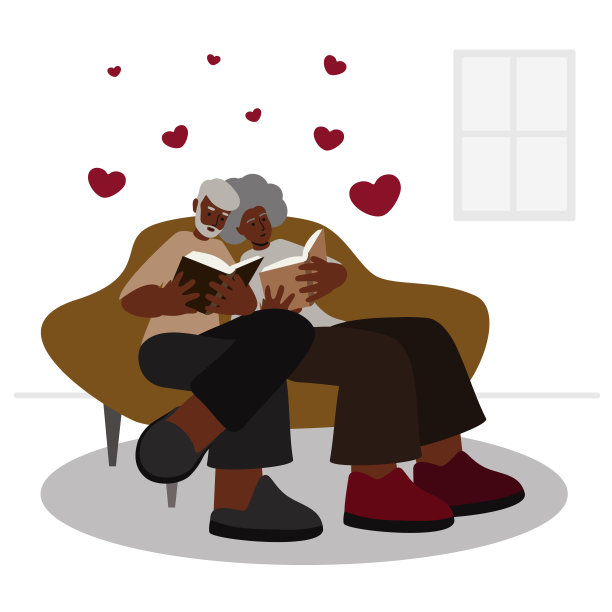 一对老年黑人夫妇坐在家里的沙发上看书图片下载