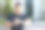 特写照片。年轻的亚洲男运动员戴着耳机站在城市街道上看手表图片下载