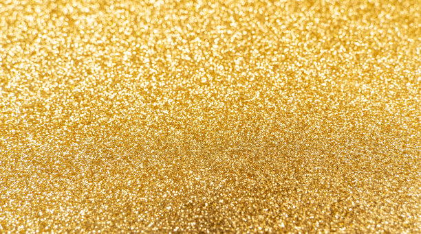 金色闪闪发光的纹理背景与亮片和火花图片下载