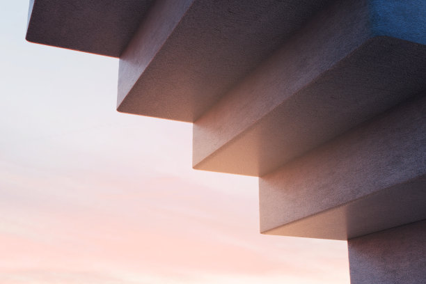 夕阳下的混凝土楼梯。现代建筑理念。库存图片图片下载