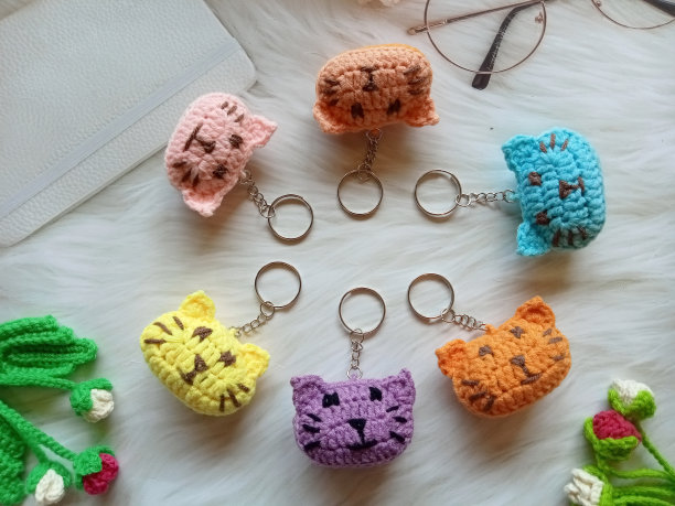 钩针脸猫，钥匙扣手工diy工艺钩针为说明，背景图像纹理图片下载