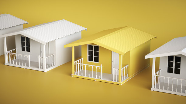 小房子。在工作室的黄色背景下，在其他房屋中脱颖而出。适合家庭度假。为家人休息。建筑外观。夏季。图片下载