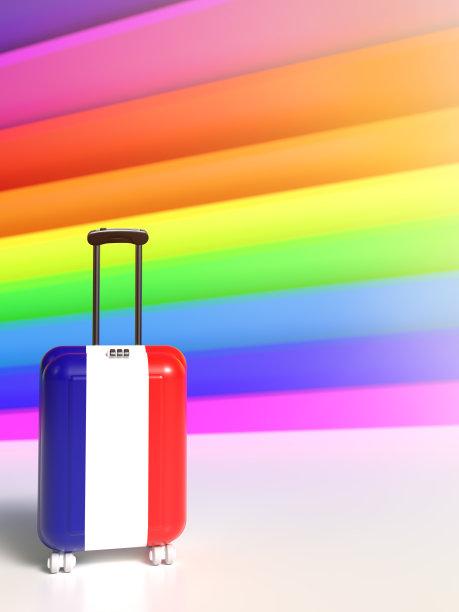 旅行箱在彩虹背景上的法国国旗的颜色。图片下载