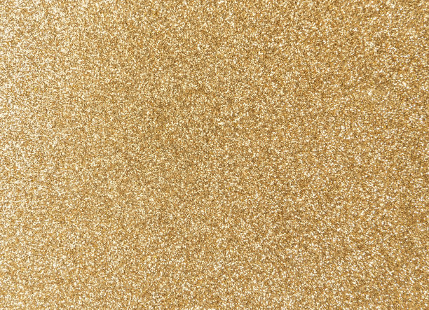 金色闪闪发光的纹理背景与亮片和火花图片下载