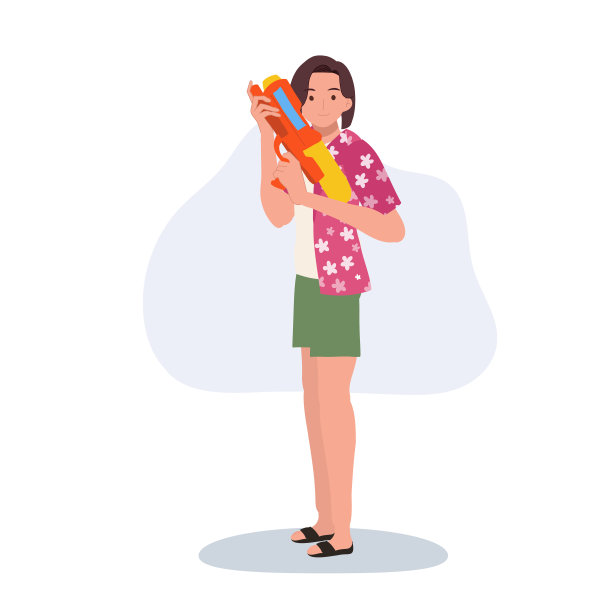 快乐的亚洲妇女享受泼水节。拿水枪的女人图片下载