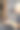 男发型师在美发沙龙用黑色吹风机和黑色圆刷为年轻的黑发白人女子吹短头发。图片下载