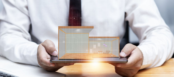 商人手里拿着一个房屋模型。图片下载