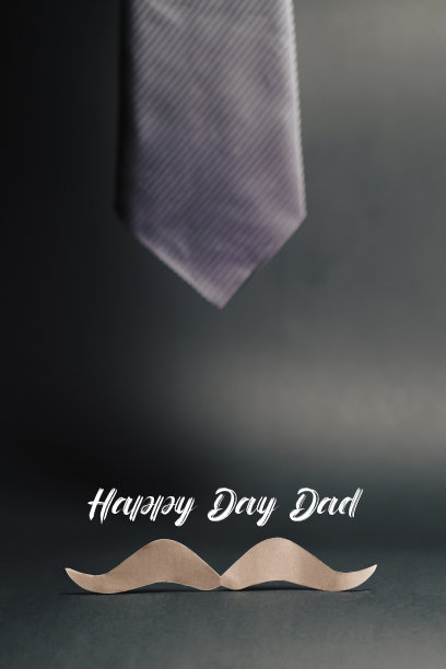 纸胡子和眼镜在灰色的表面。父亲节概念。本空间图片下载